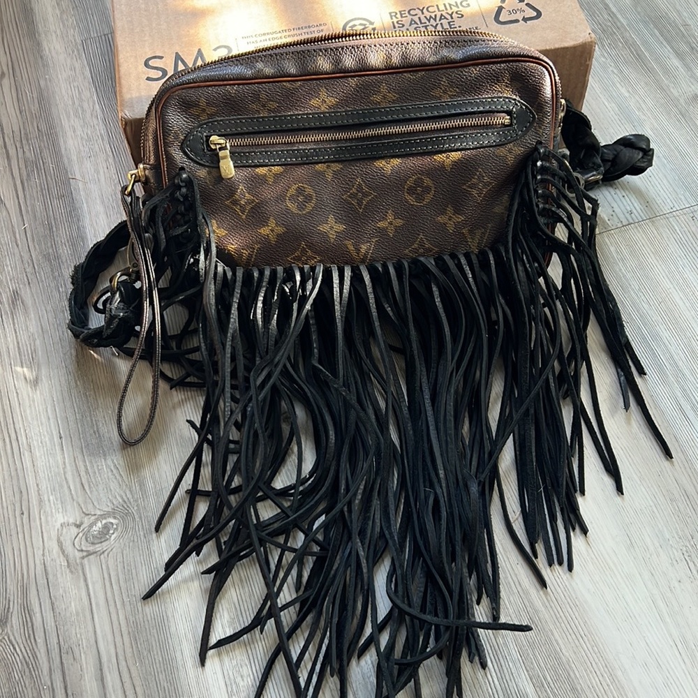 Louis Vuitton vintage boho bag. Real leather fringe and detail.